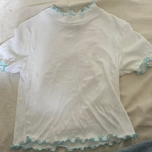 White long sleeve crop top with blue trim